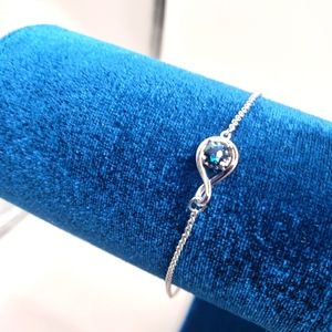 STERLING SILVER BLUE FAUX SAFIRE INFINITI BRACELET NIB.